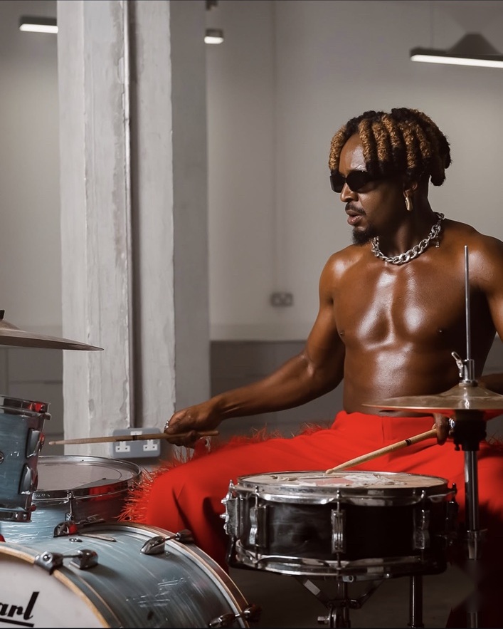 Savara seated at a drum kit