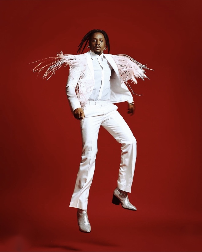 Savara in a red jacket for a solo-era portrait